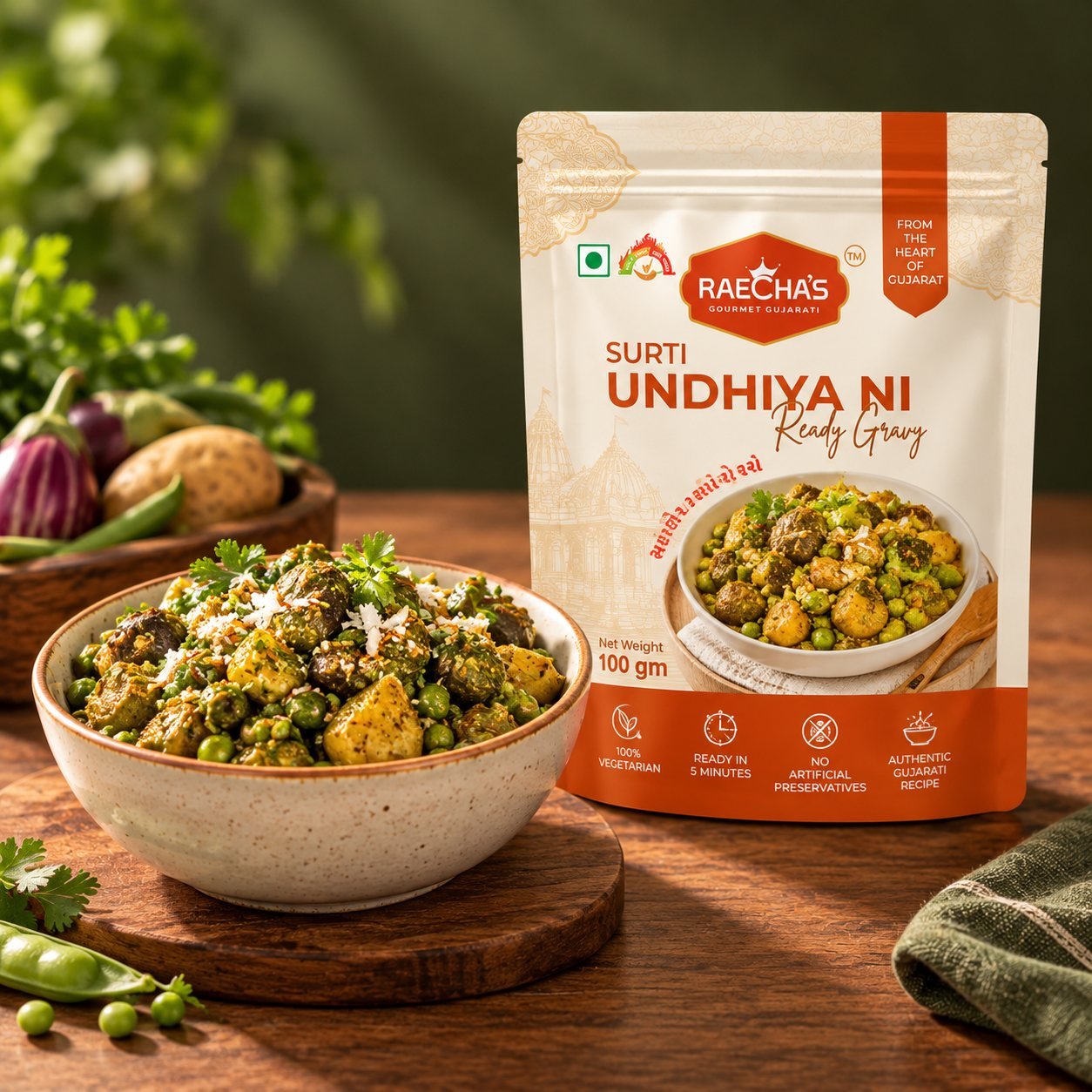 Raecha's Surti Undhiya ni Ready Gravy pouch beside a bowl of undhiyu with aubergine, potato and papdi.
